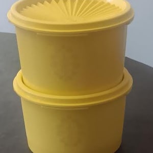 Tupperware, set of 2, stackable 1970's Servalier yellow starburst canisters, 20 oz each.