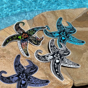 May include: Four black and white starfish stickers with intricate designs. Each sticker features a different color scheme and has the text "Starfish Aloha" printed on it.