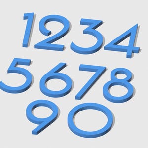 May include: A set of blue 3D numbers, 1 through 0, with a slightly raised, outlined appearance. The numbers are arranged in two rows, with the first row containing 1, 2, 3, and 4, and the second row containing 5, 6, 7, 8, 9, and 0.