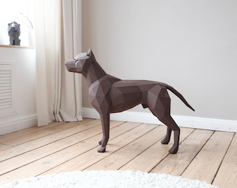 May include: A dark brown, low-poly geometric sculpture of a standing dog. The figure is constructed from flat, angular planes that form the shape of the canine, including a pointed snout, upright ears, and a straight tail, creating a faceted appearance.
