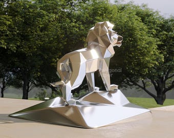 May include: A silver-coloured, metallic lion sculpture featuring a geometric, low-poly design. The lion stands on a matching angular base. The surface is highly reflective, showing highlights and shadows. The text "Polygonal Paper" is visible.