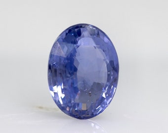 May include: A light blue oval-shaped gemstone with a faceted cut.
