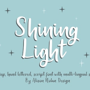 May include: A light blue background with the words "Shining Light" in a white script font. The text is accompanied by star illustrations. The text below reads "A crisp, hand lettered, script font with multi-lingual support By Alison Nolan Design."