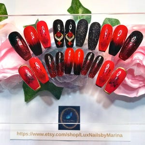Luxury handmade one of a kind press on nail kit. Long coffin shaped  red and black 2 tone sparkly nails with 3D charms and decals.