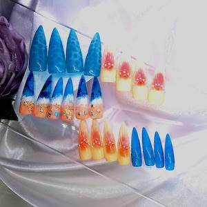 Luxury handmade one of a kind press on nail kit. Xl stiletto shape blue beach style nails with 3D embellishments.