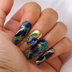 Luxury handmade one of a kind press on nail kits. Long coffin shape blue green peacock inspired nails with 3D charms