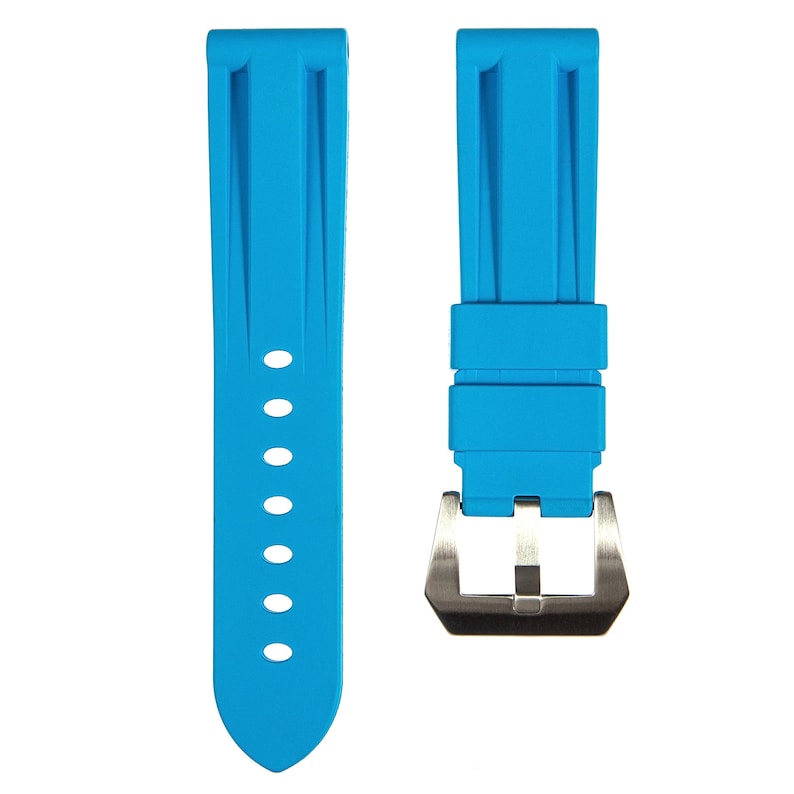 May include: A bright blue rubber watch strap with a silver buckle. The strap has a textured design and is designed for a watch with a 22mm lug width.