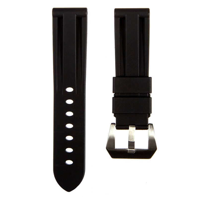 May include: Black rubber watch strap with a stainless steel buckle. The strap has a textured surface and is designed for a watch with a 22mm lug width.