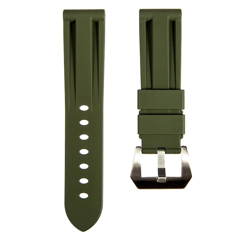 May include: A green rubber watch strap with a silver buckle.