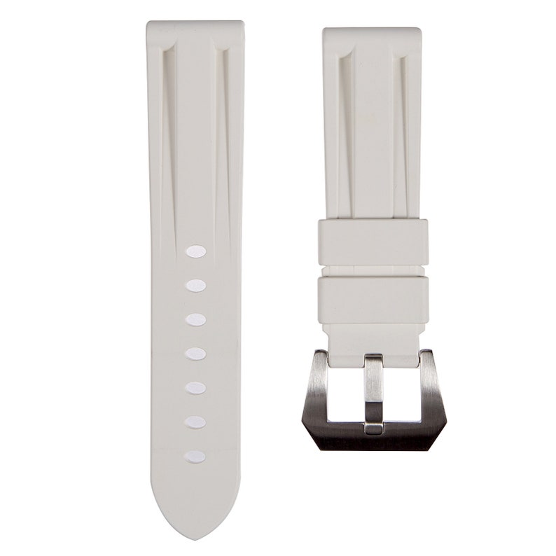 May include: A white silicone watch strap with a silver buckle. The strap has a textured design and is designed for a watch with a 22mm lug width.