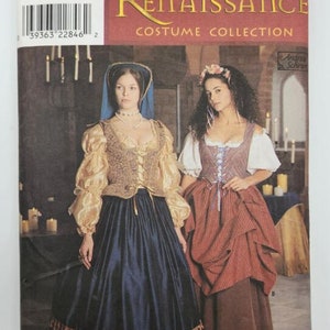 May include: Simplicity pattern 8715 for Renaissance costumes. The pattern includes two designs: a gold and blue gown with a fitted bodice and a red and brown gown with a fitted bodice and a gathered skirt.