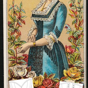 May include: Vintage advertisement for BeautyandBustle corsets. The ad features a woman wearing a blue dress with a white lace collar and a gold bracelet. The text "THESE CORSETS RELIEVE THE DELICATE AND VITAL ORGANS OF ALL INJURIOUS PRESSURE." is printed at the bottom of the ad.