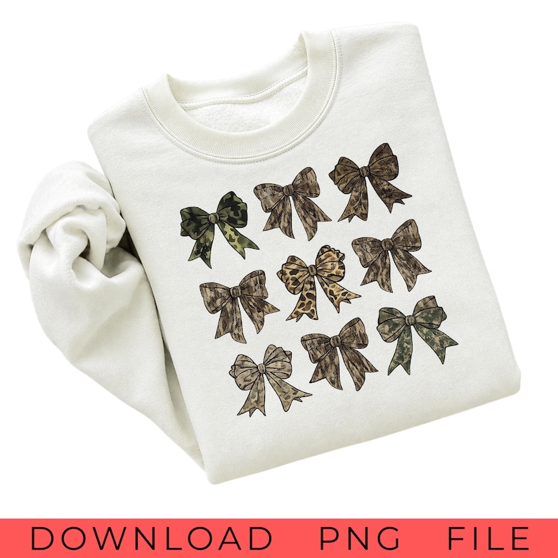 May include: A cream-colored crewneck sweatshirt featuring a graphic print of nine decorative bows arranged in a grid. The bows display various patterns including camouflage, leopard print, and solid brown tones with textured details on each bow.