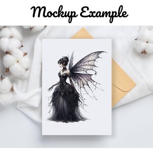 May include: A greeting card featuring a watercolor illustration of a gothic fairy in a black gown with large, detailed wings. The card is on a white surface with cotton and an envelope.