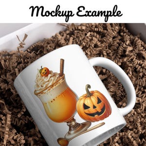 May include: White ceramic mug with a handle, featuring a pumpkin with a jack-o'-lantern face and a fall-themed beverage with whipped cream and a cinnamon stick.