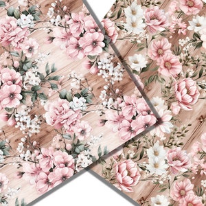 Peut inclure: Un motif sans couture repr&eacute;sentant des fleurs roses et blanches sur un fond en bois. Les fleurs sont dispos&eacute;es en un motif r&eacute;p&eacute;titif, certaines fleurs se chevauchant. Le fond en bois est de couleur brun clair.