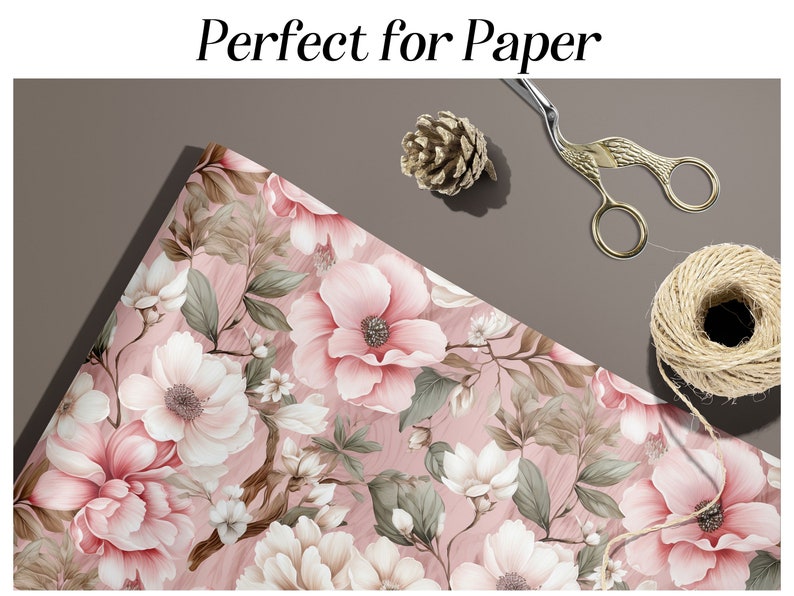 Peut inclure: Papier d'emballage floral rose avec un fond blanc et un motif floral d&eacute;licat. Le papier est pli&eacute; en deux et a une ombre port&eacute;e sur le fond.