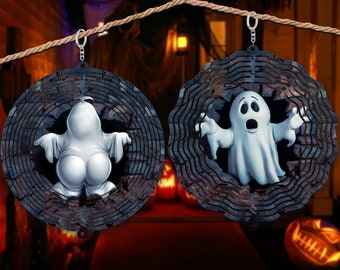 May include: Two black metal wind spinners with a ghost design. Each spinner has a swirling pattern and a ghost with a white sheet and a surprised expression.