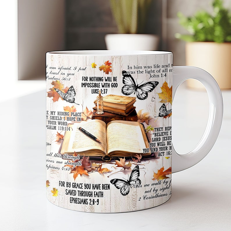 May include: White ceramic mug with a colorful design featuring butterflies, fall leaves, and bible verses. The verses include "In him was life and was the light of all men John 1:4", "For nothing will be impossible with God Luke 1:37", "They rep "Believe I Lord Jesus you will be you and your h Act 16:", "E my hiding place y shield. I hope in your word Psalm 119:114", "All this through ives me strength pians 4:13", "For by grace you have been saved through faith Ephesians 2:8-9", and "For we walk by not by sight 2 Corinthians 5".