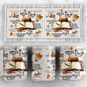 May include: A white ceramic mug with a fall-themed design. The mug features a stack of books, a pen, and butterflies. The design includes the text "For nothing will be impossible with God" and "For by grace you have been saved through faith".