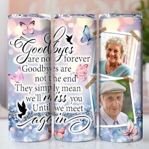 May include: A set of three stainless steel tumblers with a memorial theme. The tumblers feature a design with butterflies, photos, and the text "Goodbyes are not forever. Goodbyes are not the end. They simply mean we'll miss you until we meet again."