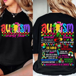 May include: Black t-shirt with a colorful autism awareness design. The design includes the word "autism" in rainbow colors, a puzzle piece, a lightning bolt, and the words "world tour". The back of the shirt has additional text about autism awareness, including the phrases "See the ability, not the disability", "Love need no words", "Be kind", "Think differently", "Neurodiversity", "Inclusion matters", and "Acceptance is a choice".