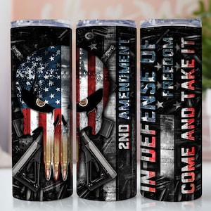 May include: Three stainless steel tumblers with a skull design and an American flag pattern. The tumblers feature the text "2nd Amendment", "In Defense Of Freedom", and "Come And Take It".