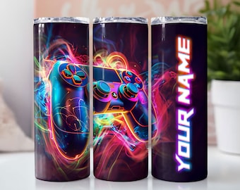 May include: Three stainless steel tumblers with a colorful design of a video game controller and the words "Your Name" on one of the tumblers.