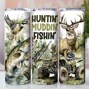 May include: A set of three stainless steel tumblers with a hunting, mudding, and fishing theme. The tumblers feature a green, brown, and white camouflage pattern with images of a duck, fish, deer, and a quad bike.