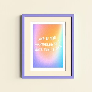 May include: A framed print with a rainbow gradient background and white text that reads "AND IF YOU WONDERED IF I HATE YOU, I DO."