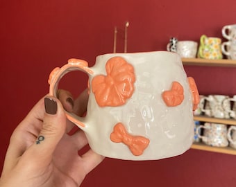 Handmade Ceramic Coffee Mug: Orange Bows, Unique Design