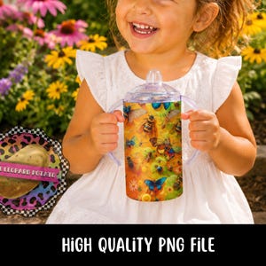 May include: A clear sippy cup with a vibrant design of bees and butterflies. The cup has a clear lid and purple handles. The text "HIGH QUALITY PNG FILE" is at the bottom of the image.