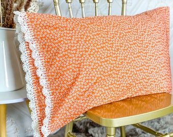 Handmade crochet trim floral pillowcase. Pretty orange ditzy flower fabric with ivory organic linen crochet edge pillow case sham