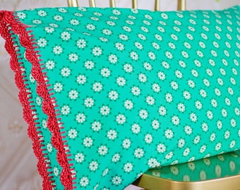 Handmade crochet trim teal floral pillowcase. Pretty turquoise fabric with pink red bamboo crocheted trim pillow case shams