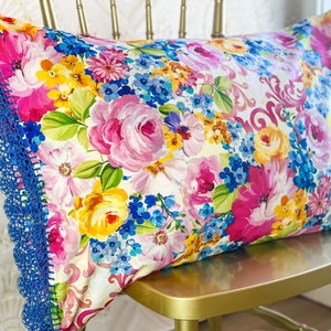 Handmade crochet trim floral pillowcase, pink, blue, yellow flower fabric with blue crocheted edge. Pretty vintage look pillow case sham