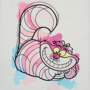 May include: Embroidered illustration of the Cheshire Cat from Alice in Wonderland. The cat is pink and white with a wide grin and yellow eyes. The background is a watercolor wash of pink, blue, and white.