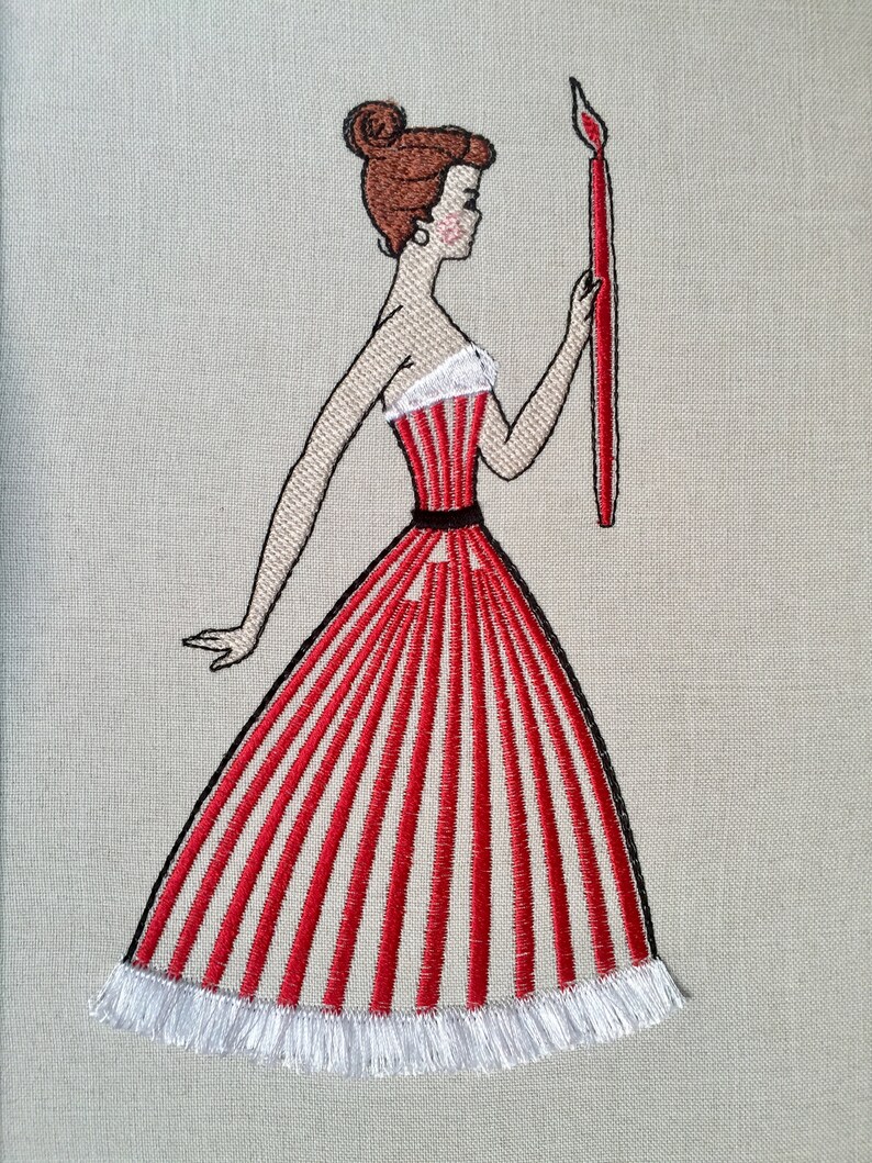 May include: Embroidered image of a woman in a red and white striped dress holding a red candle. The dress has a white fringe trim.