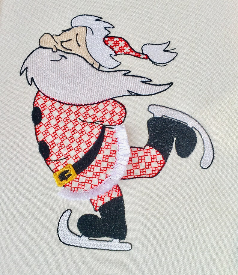 May include: Embroidered design of Santa Claus ice skating. He is wearing a red and white checkered suit with a white trim and a white beard. He has a black hat with a white pom-pom.