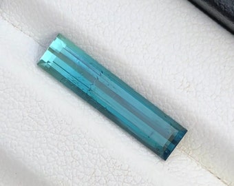 2.3 Carats  Natural blue Tourmaline Faceted|| Single Piece||  Dimensions;17.9mm x 4.2mm x3.2mm| Clarity: Slightly Included