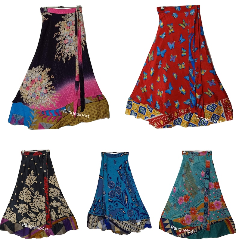 May include: A collection of wrap skirts in various colors and patterns. The skirts feature floral, butterfly, and geometric designs. Colors include black, red, blue, and teal. Each skirt has a unique border and tie closure.