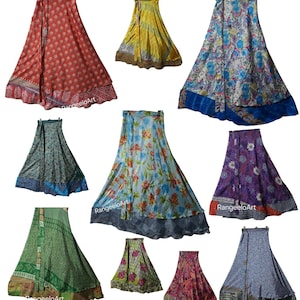 May include: A collection of colorful, long wrap skirts. The skirts feature various patterns, including floral, geometric, and paisley designs. Colors include red, yellow, blue, green, and purple. The skirts are made of a lightweight fabric.