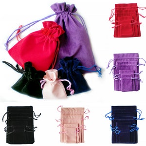 May include: Set of 10 velvet drawstring pouches in a variety of colours, including black, red, purple, blue, and pink. The pouches are arranged in groups of two or three, with each group featuring a different colour. The pouches are made from soft, luxurious velvet and are ideal for storing small items such as jewellery, gifts, or favours.