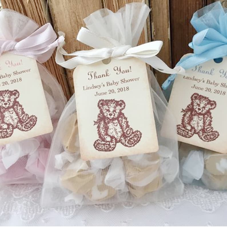 May include: Three small white organza bags with a teddy bear design on the tag. The tags have the text "Thank You!" and the date "June 20, 2018".