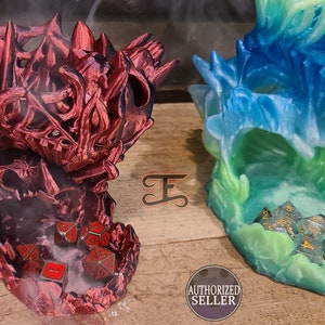 May include: Two 3D printed dragon skull dice towers, one red and one blue and green. The red tower has dice inside and smoke coming out of the top. The blue and green tower has dice inside. Both towers are on a wooden surface.  AUTHORIZED SELLER