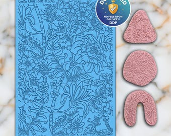 May include: A light blue clay tool featuring a floral design, with three pink clay stamps in various shapes, also with floral patterns. The text "Goto Clay Tools #576" is visible. A circular sticker with the text "DUTY PAID" is also present.