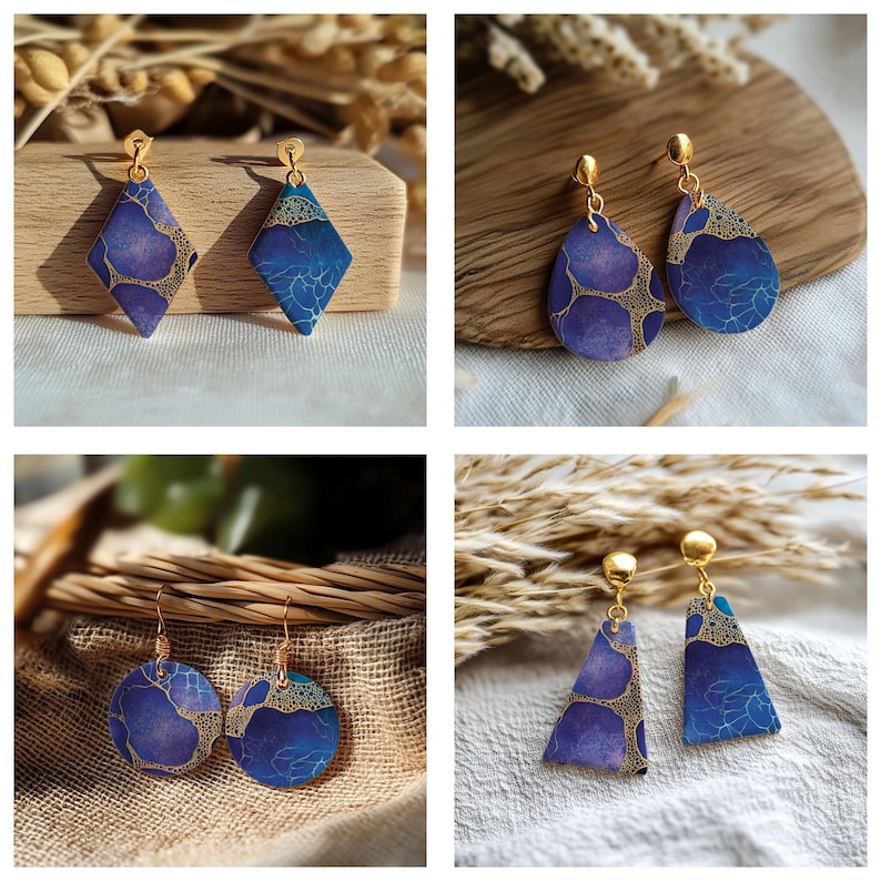 May include: A collection of four pairs of dangle earrings featuring a blue and purple gradient pattern with gold-toned filigree accents. The set includes diamond, teardrop, circular, and triangular shapes, all suspended from gold-toned metal posts.