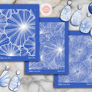 May include: Blue and white clay tools and earrings. The tools are rectangular with a white floral design and the text "Goto Clay Tools" and "SS#1254", "SS#1255", and "SS#1256". The earrings are white with blue designs.