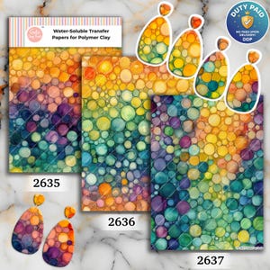 May include: Three rectangular sheets of water-soluble transfer paper for polymer clay featuring a colorful bubble pattern in shades of yellow, orange, purple, and teal. The sheets are labeled 2635, 2636, and 2637, accompanied by matching teardrop-shaped earrings.