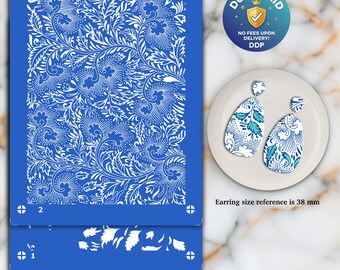 May include: A blue stencil with a white floral design, alongside a pair of matching earrings on a white plate. The stencil's printable area is 3.74" x 4.92". The earrings are teardrop-shaped with a white, blue, and teal floral pattern. The earring size reference is 38 mm.