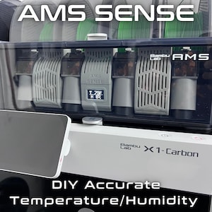 May include: A 3D printer filament storage system with the text "AMS SENSE" and "Bambu Lab X1-Carbon". The system includes a display showing temperature and humidity. The text "DIY Accurate Temperature/Humidity" is also visible.